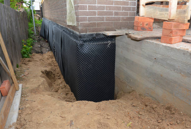 Happy homeowners after waterproofing job in Miamiville
